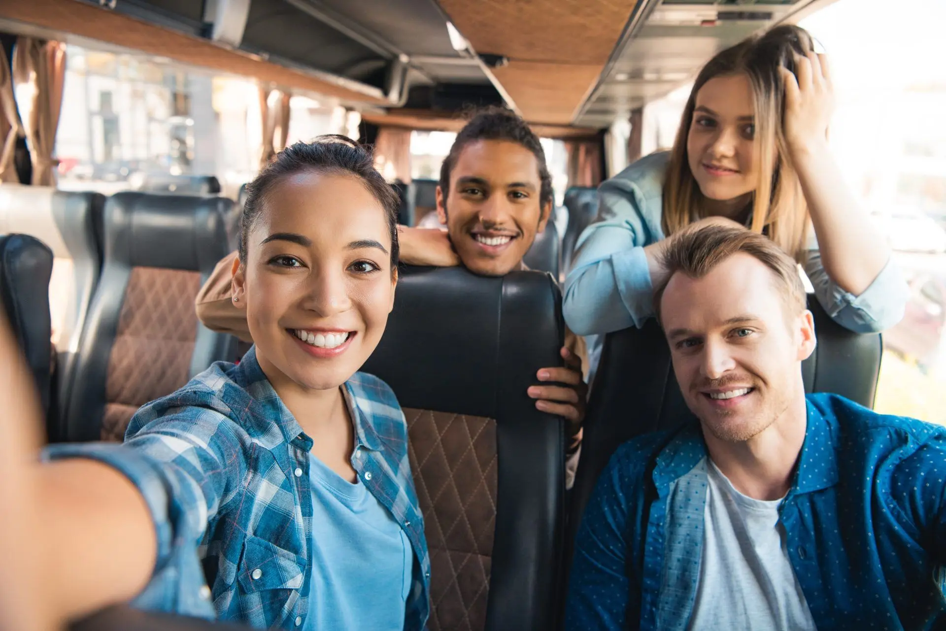 Happy Corporate Group Travelling with West London Minibus Hire Smiling business team enjoying a comfortable journey with West London corporate minibus hire service