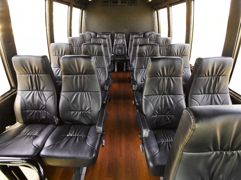Luxury interior of executive minibus with leather seats for West London Minibus Hire. Ideal for comfortable travel.