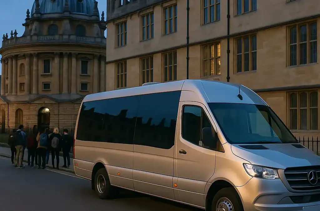 Professional minibus parked outside Oxford University historic college building for group day trip